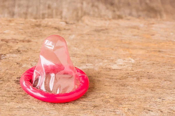 Close up condom on wooden table — Stock Photo, Image