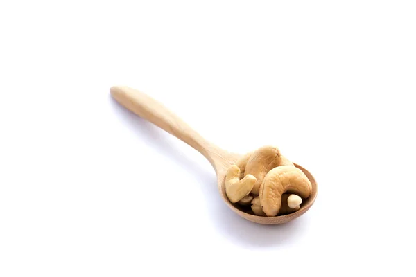 Cashews in the wooden spoon on white background — Stock Photo, Image