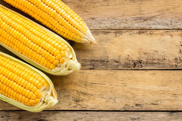 Fresh corn on wooden table background — Stock Photo, Image