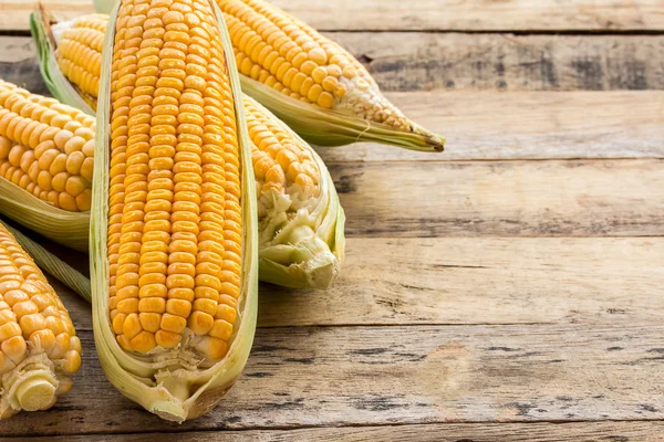 Fresh corn on wooden table background — Stock Photo, Image