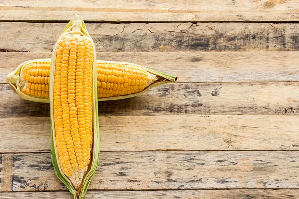 Fresh corn on wooden table background — Stock Photo, Image