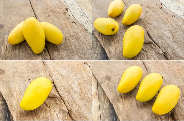 Ripe mango on the wooden floor — Stock Photo, Image