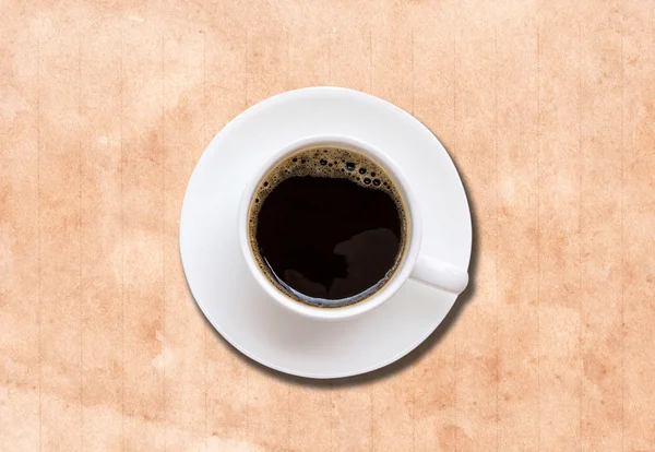 Kopp kaffe i en vit kopp på pappersstruktur — Stockfoto