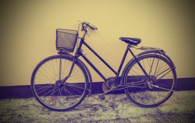 Vintage Bicycle Against Grunge Wall clipart