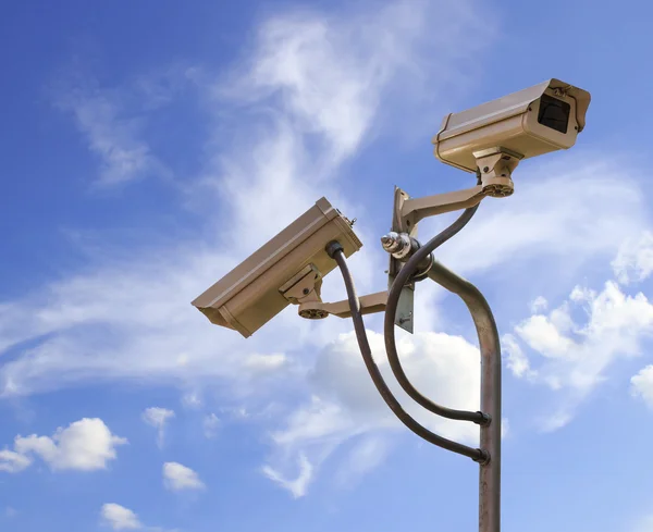 Security camera on blue sky background — Stock Photo, Image