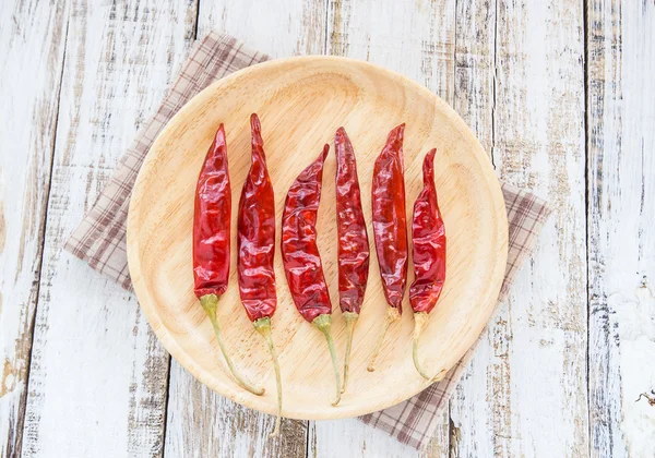 Dry chili papper in wooden plate — Stock Photo, Image