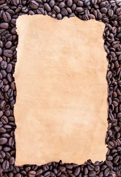 Old paper on coffee beans background Stock Photo