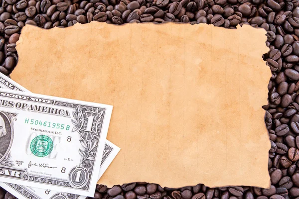 Dollar en oud papier op koffie bonen — Stockfoto