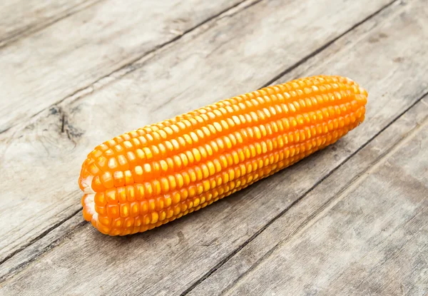 Dried corn on old wooden background — Stock Photo, Image