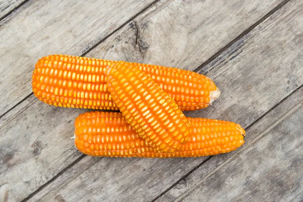 Dried corn on old wooden background — Stock Photo, Image