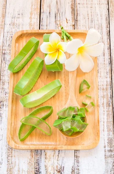 Aloe vera in wooden plate on wooden background — Stock Photo, Image