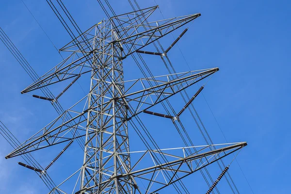 High voltage tower with blue sky background. — Stock Photo, Image