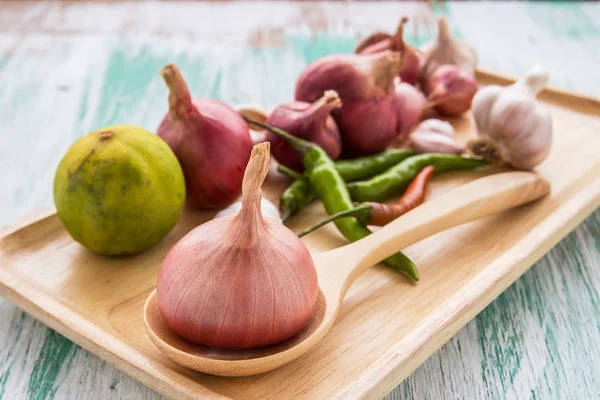 Fresh organic red onion garlic and chili on wooden table — Stok fotoğraf