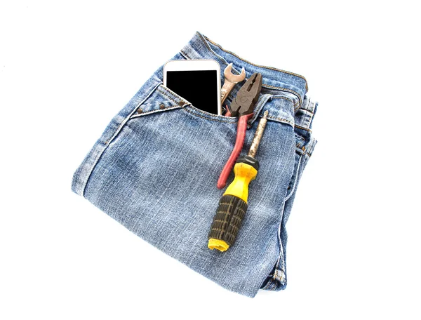 Blue jean, smart phone and tools on white background — Stock Photo, Image