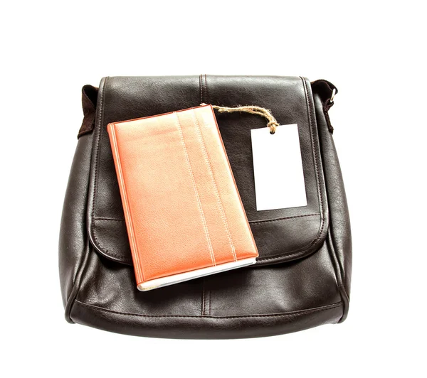Bolsa de couro marrom, notebook e cartão branco na mesa de madeira — Fotografia de Stock