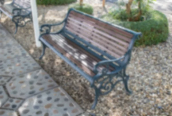 Rozmazané lavička v parku — Stock fotografie