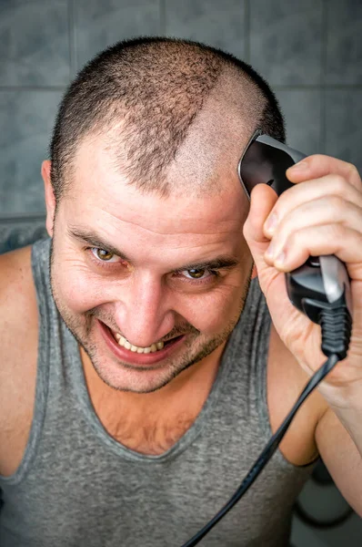 Crazy Man Cuts Himself Hair Clipper Stock Picture