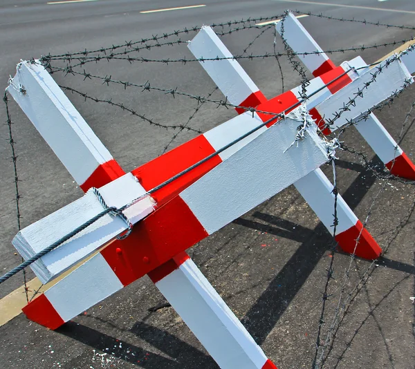 Barbed wire blocking the road — Stock Photo, Image