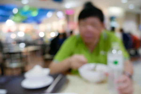 Rozmazané lidí jíst v restauraci — Stock fotografie
