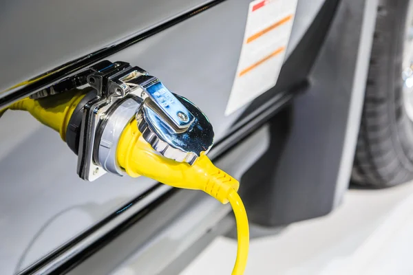 Power supply plugged into car — Stock Photo, Image