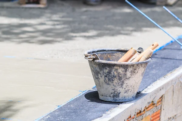 Plasterer concrete worker smooth the cement — Stock Photo, Image