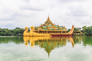 Karaweik ship at Kan Daw Gyi lake or Karaweik palace in Yangon clipart