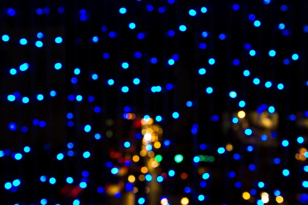 Geceleyin bulanık Noel ışıkları — Stok fotoğraf