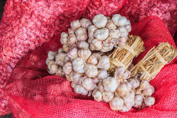 Garlic in bag or sack — Stock Photo, Image