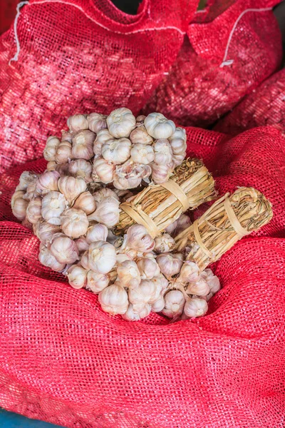 Garlic in bag or sack — Stock Photo, Image