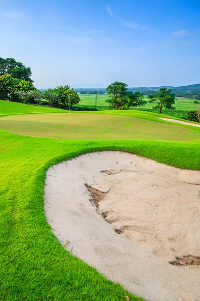 Sunset on golf field — Stock Photo, Image