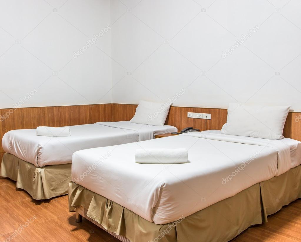 White bed and towels on the bed