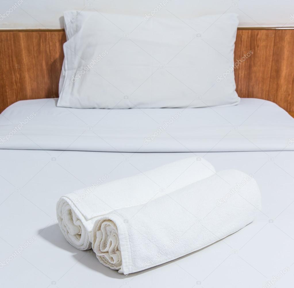 White bed and towels on the bed