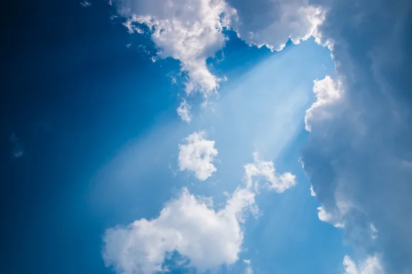 Rays of light shining through dark clouds — Stock Photo, Image