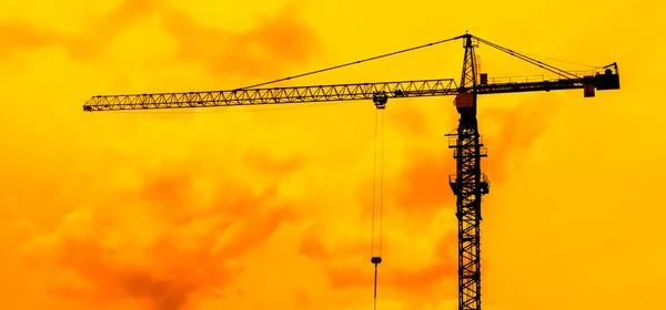 Construction site crane silhouettes — Stock Photo, Image