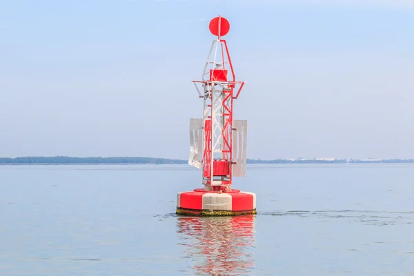 Floating red beacon in sea — Stock Photo, Image