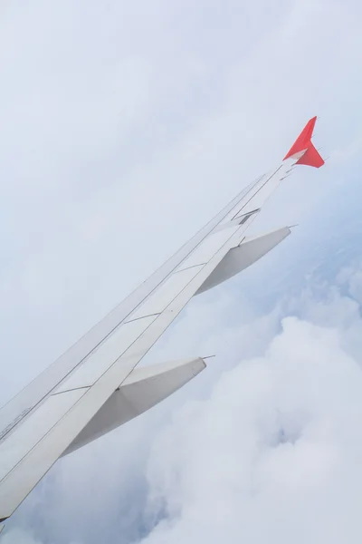 Airplane wing out of window — Stock Photo, Image