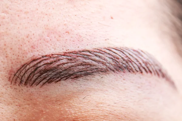 Female plucking eyebrows — Stock Photo, Image