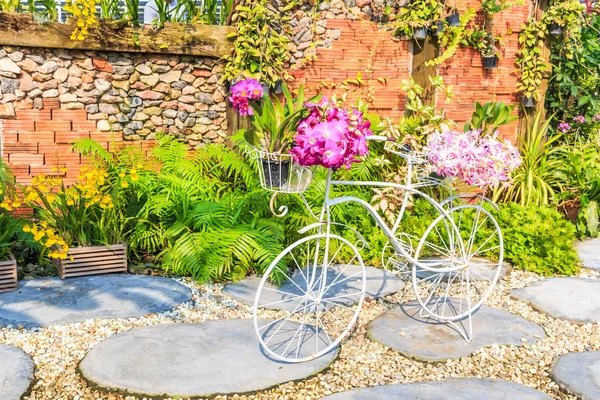 Flowers on bicycle stand — Stock Photo, Image
