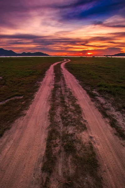 Sunset over rural road — Stock Photo, Image