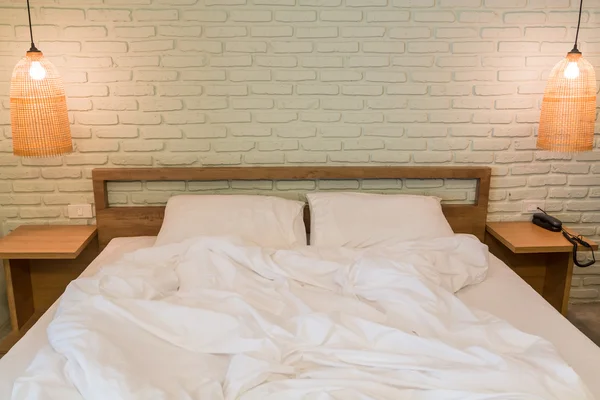 Bed with pillows in room — Stock Photo, Image