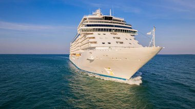 Cruise ships are sailing the seas, taking tourists on a journey around the world.