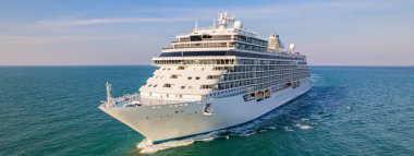 Cruise ships are sailing the seas, taking tourists on a journey around the world.