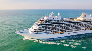 Cruise ships are sailing the seas, taking tourists on a journey around the world.