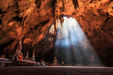 Cave and sun in Thailand clipart