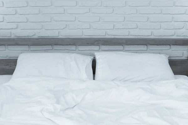 Unmade bed with Pillows — Stock Photo, Image