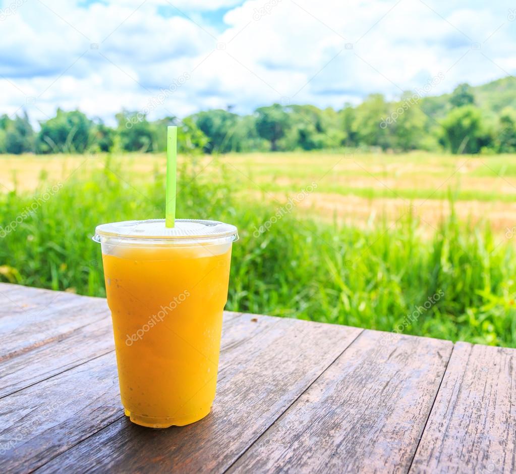 orange juice in plastic cup