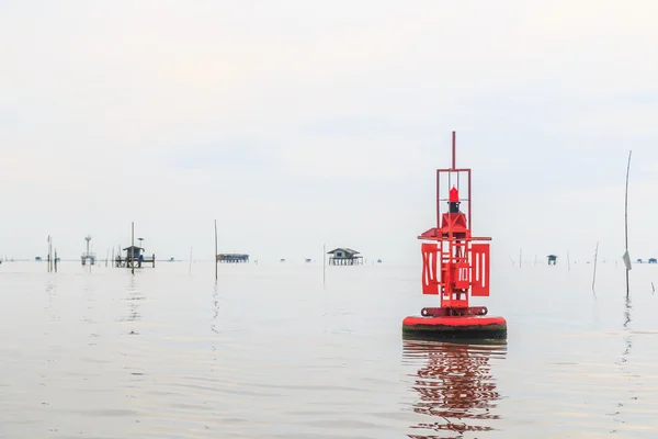 Floating red beacon in sea — Stock Photo, Image