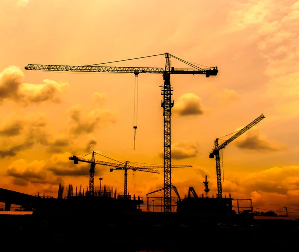 Construction site cranes silhouettes — Stock Photo, Image
