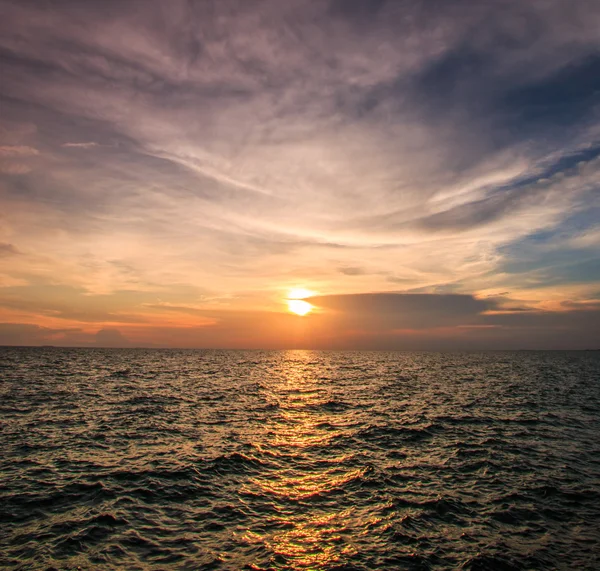 Sunset over sea waves — Stock Photo, Image