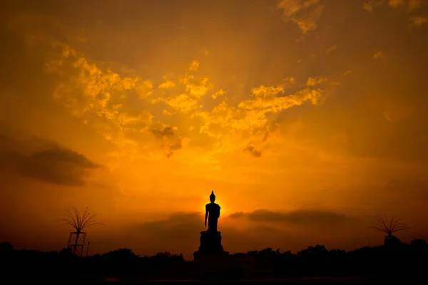 Buddha statue silhouette over sunset — Stock Photo, Image